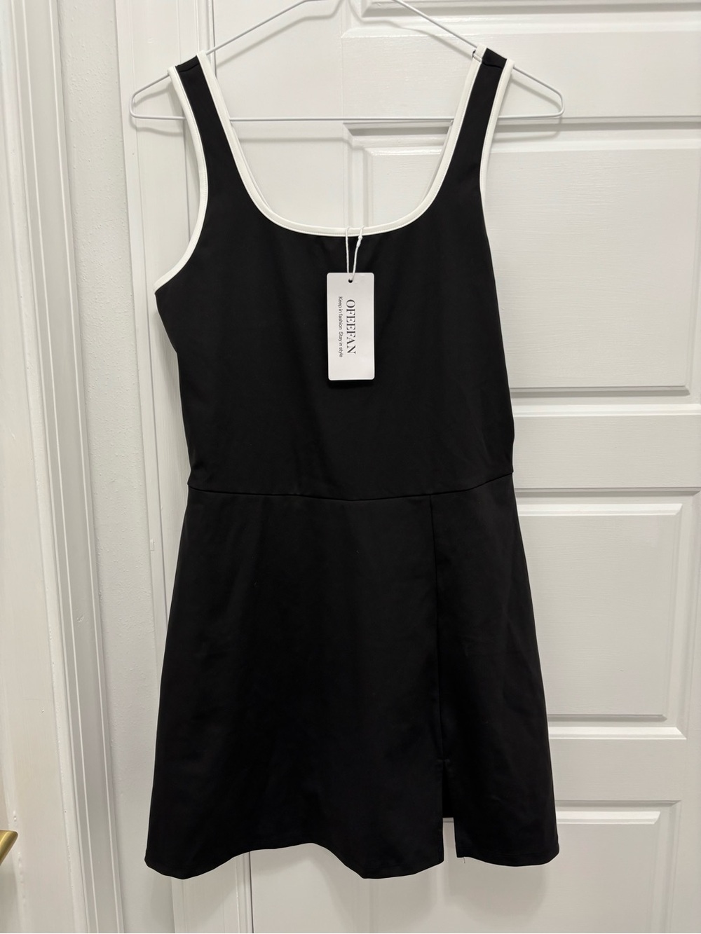 Black Sleeveless A-Line Sports Dress with White Trim